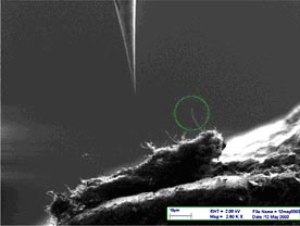 Zyvex - Probe tip approaching carbon nanotube (CNT) 