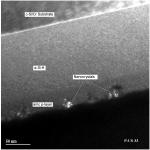  Cross sectional Transmission Electron Microscope (TEM) image of the top half of an amorphous silicon (a-Si:H) solar cell with a very high open circuit voltage. The nanocrystals can be seen clearly in the p-layer. The scale in nanometers (nm) is shown at the bottom left. This image was taken at the National Renewable Energy Laboratory compliments of Mowafak Al-Jassim and Kim Jones.