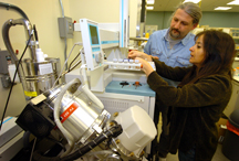 Discovery Park researchers, from left, Jiri Adamec and Maria Sepulveda analyze molecule samples taken using gas chromatography coupled with a mass spectrometer at a Purdue laboratory in Discovery Park's Bindley Bioscience Center. Adamec, a faculty researcher in metabolomics and proteomics, and Sepulveda, an assistant professor in the Department of Forestry and Natural Resources, are examining the development of biomarkers in fish that have been exposed to chemicals and contaminants such as herbicides. The research has applications in how humans might adversely react to the same chemicals. (Purdue News Service photo/David Umberger)