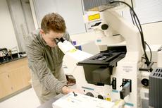 Photo by Daniel Kim.

Paul Wallace demonstrates the use of a confocal microscope. He specializes in optical microscopes and image processing. 