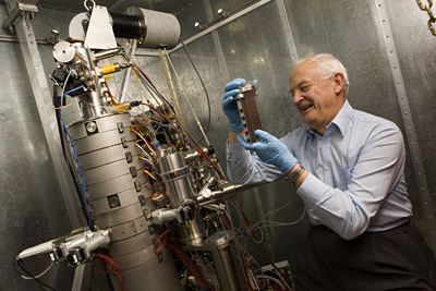 Lindsay France/University Photography
John Silcox, the David E. Burr Professor of Engineering, with the new scanning transmission electron microscope. The new instrument gives materials scientists unprecedented atomic level views of their work.