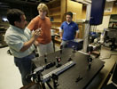 SOUTHEASTERN PATENT – From left, Southeastern Louisiana University physicist Sanchiro Yoshida explains points about his patented deformation detection instrument to student assistants Christopher W. Schneider and John A. Gaffney. The instrument, Southeastern's first patent, helps detect structural weaknesses in various materials. (Photo: Randy Bergeron, Southeastern Public Information Office)