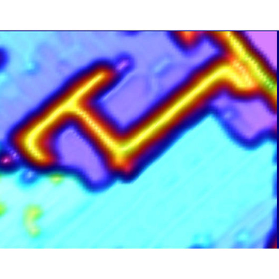 Figure 1: Scanning-tunneling microscopy image of acetophenone lines on a silicon surface. The lines of acetophenone can be seen as a bright orange line against the blue background of the surface.