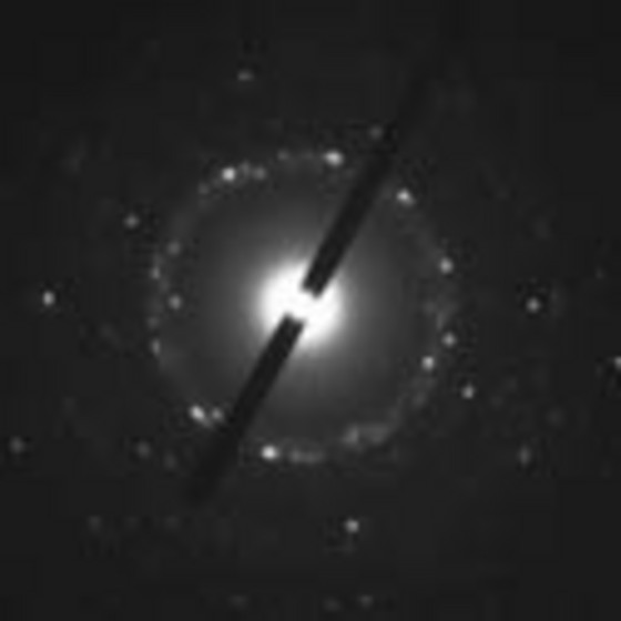 Figure 1: The distance between the white spots in this electron diffraction pattern are inversely proportional to the distance between atoms in the CuO nanoparticles and will move closer together or further apart depending on whether the nanoparticles expand or contract, respectively, when they are heated.

