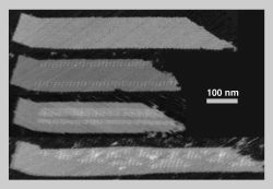 Ribbon-like DNA tile crystals grown from DNA origami seeds. Credit: Caltech/Winfree, Rothemund, Barish, Schulman
