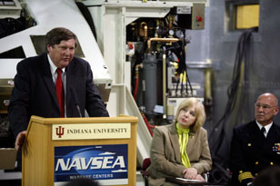 IU physicist and LINAC principal investigator Paul Sokol, left, IU Provost Karen Hanson and Crane commander Captain Charles LaSota were among the speakers at Monday's ceremony.