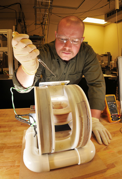 Kyle Solis, a graduate student intern in Nanomaterials Sciences, prepares a sample for mixing using a new approach called vortex field mixing. 