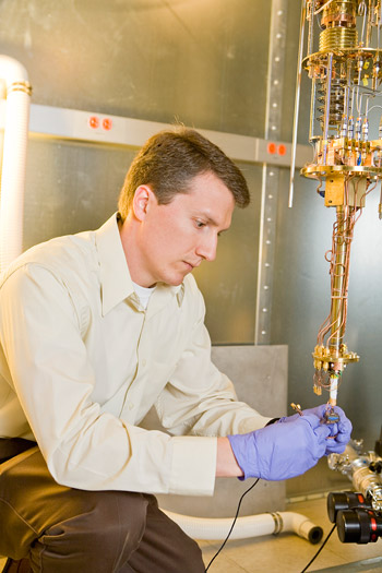 Jason Petta, an assistant professor of physics, has found a way to alter the property of a lone electron without disturbing the trillions of electrons in its immediate surroundings. Such a feat is an important step toward developing future types of quantum computers. (Photos: Brian Wilson)