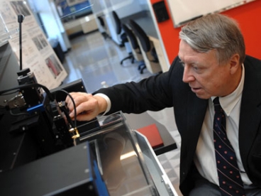 Edwin L. Thomas, head of the Department of Materials Science and Engineering and the Morris Cohen Professor of Materials Science and Engineering, uses a Scanning Acoustic Microscope in MIT's Laboratory for Advanced Materials. Photo: Patrick Gillooly 