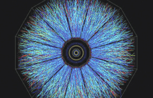 This image of a full-energy collision between gold ions shows the paths taken by thousands of subatomic particles produced during the impact.