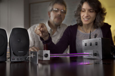 Jim Overhiser, former physics teacher in residence in the Cornell PhysTec program, and Julie Nucci, director of education programs at the Center for Nanoscale Systems, demonstrate a science exhibit called Converting Light to Music. Robert Barker/University Photography