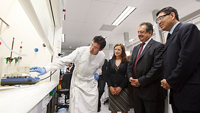 PhD student Sean Muir, AIBNs Dr Denisa Jurcakova, Dow chairman and CEO Andrew Liveris and Professor Max Lu