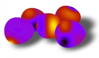 Collage of NIST "nano-eggs"  simulated magnetic patterns in NISTs egg-shaped nanoscale magnets.