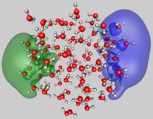 Uzi Landman/Georgia Tech

This image shows the surface attachment mode of two excess electrons to a water cluster (average diameter of close to 2nm) comprised of 105 molecules. The shown configuration was obtained from first-principles quantum simulations. The two wave functions each occupied by one excess electron, depicted in blue and green, are localized at opposite sides of the cluster and they are shown superimposed on the water molecules. The oxygens and hydrogens of the water molecules are represented by red and gray spheres, respectively.