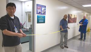 ORNL researchers (from left) Zhili Feng, Stan David and Alan Frederic display a length of wire more than 15 feet long fabricated with the friction-stir extrusion method. They eventually ran out of the magnesium-aluminum alloy feed stock. Friction-stir extrusion is an energy-efficient method for making wire from high-temperature, recyclable materials.