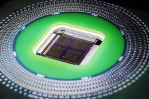 An array of piezoelectrically modulated resistive memory (PRM) cells is shown being studied in an optical microscope.Credit: Gary Meek