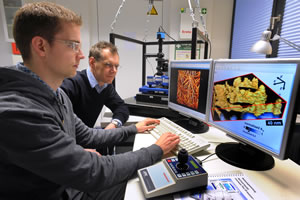 Professor Robert Magerle (right) watches Eike-Christian Spitzner working with the
JPK NanoWizard AFM 