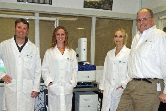 Pictured from Left to Right with NanoInks NLP 2000 Desktop Nanofabrication Instrument are Dr.
Tad Daniel, NanoProfessor Scientific Liaison; Bridget Basan, Wilbur Wright College; Paulina
Szadkowska-Kociszewski, Harry S. Truman College; and Dr. John Ireland, Scientific Director,
NanoProfessor Nanoscience Education Program.