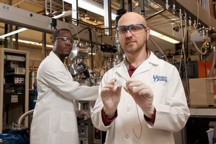 Joshua Zide (right), assistant professor of materials science and engineering, at work in the laboratory with Pernell Dongmo, a doctoral candidate in the College of Engineering.
Photo by Kathy F. Atkinson