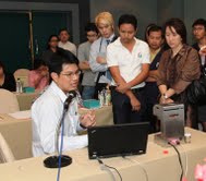 Rungroj Maolanon (seated) giving a talk on NanoNose technology to private sector groups.
