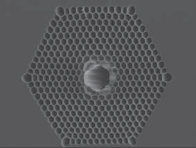 Provided/Gaeta Lab
Electron microscope photo of a cross-section of photonic bandgap fiber. Tiny glass tubes surrounding the core bend light waves in such a way that they interfere and cancel out, focusing all the energy of a beam into the hollow core.