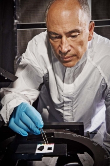 Optics engineer John Hagopian works with a nanotube material sample in this file photograph from NASA's Goddard Space Flight Center in Greenbelt, Md.
Image Credit: NASA Goddard/Chris Gunn