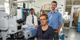 UAlberta researcher Jillian Buriak (centre) worked with post-doctoral fellows Erik Luber (right) and Hosnay Mobarok to create nanoparticles that could lead to printable or spray-on solar cells.