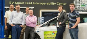 Researchers (pictured left to right) Dileep Singh, Carlo Segre, Mike Duoba, John Katsoudas, Elena Timofeeva, and Chris Pelliccione stand by one of the plug-in electric vehicles they hope to revolutionize with the IIT-Argonne nanoelectrofuel flow battery technology they are developing.