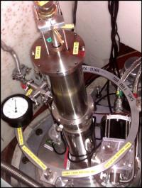 The IRIS instrument is viewed from above. The cement sample is lowered about 120 cm into a cryostat so that it is hit by the neutron beam. The cryostat is emptied of air to avoid signal noise from air.

Credit: Johan Jacobsen, Niels Bohr Institute