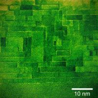 Not a brick wall. Electron microscope image of a cross section of the newly characterized tunable microwave dielectric clearly shows the thick layers of strontium titanate "bricks" separated by thin "mortar lines" of strontium oxide that help promote the largely defect-free growth of the bricks.

Credit: TEM image courtesy David Mueller. Color added for clarity by Nathan Orloff.