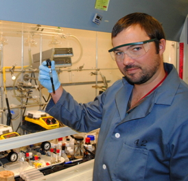 Hunter McDaniel, Los Alamos National Laboratory postdoctoral researcher, works in the laboratory developing next-generation quantum dots that could revolutionize photovoltaic technology. Los Alamos National Laboratory image. 