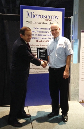 Rob Cain, Asylum Research US Technical Sales Manager (right) receives the award from Charles Lyman, Editor-in-Chief, Microscopy Today.