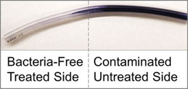 Liquidinfused polymers absorb slippery lubricants like a sponge, rendering surfaces continuously slippery for longlasting preventative effects against deadly infections caused by bacterial biofilms. In this experiment, biofilm formation on the right side of medical tubing is visible after being stained, whereas the treated section of the tubing on the left remains free of biofilms. Credit: Wyss Institute at Harvard University