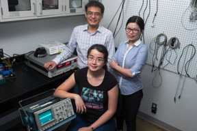 Rice University researchers (clockwise from front) Man-Nung Su, Wei-Shun Chang and Fangfang Wen discovered a new method to tune the light-induced vibrations of nanoparticles through slight alterations to the surface to which they are attached.
CREDIT: Jeff Fitlow/Rice University