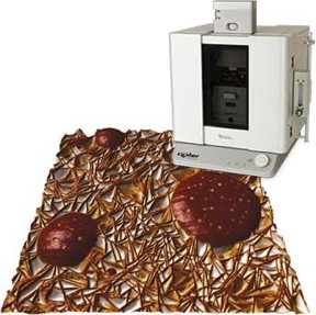  Cypher ES Polymer Edition AFM pictured with an image of syndiotactic polypropylene (sPP) and polystyrene (PS) that was imaged after heating to  ~135 then allowed to cool. The round, isolated domains are PS and the continuous matrix around them is the sPP. Scan size 3 m. 