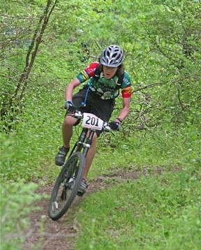 Bikes have a harder time turning around than pedestrians, especially on a narrow path. Scientists say the same principle  binding the direction of motion to angular momentum  can keep electrons moving powerfully enough to overcome material imperfections, or bumps in the road. "XCBikeRacer" by Daniel Plunkett. Licensed under CC BY-SA 3.0 via Commons.