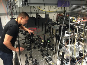 Paul Klimov, a graduate student in the University of Chicago's Institute for Molecular Engineering, adjusts the intensity of a laser beam during an experiment. Because the laser light lies within the infrared spectrum, it is invisible to the human eye.
CREDIT: University of Chicago