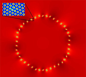  The computational density field shows a circular solid crystal with a different orientation in relation to the surrounding solid material. The blue areas seen on the edges are lattice defects caused by differences in orientations. One of them has been magnified in order to show the defect in the periodic structure of the lattice.CREDIT: Aalto University