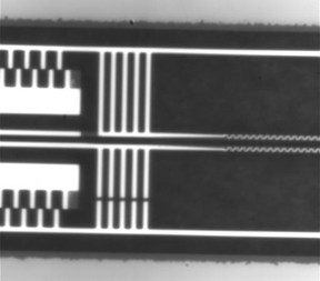 This is a video of the high-precision micro-electromechanical system (MEMS) used to control the distance between two beams at different temperatures. The video is taken under a high magnification microscope. The whole video frame dimension is comparable to the diameter of a strand of human hair.
CREDIT: Raphael St-Gelais, Lipson Nanophotonics Group, Columbia Engineering