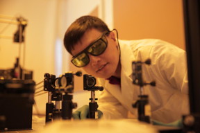 Hongrui Jiang inspects the alignment of a light source to illuminate new-generation lateral solar cells. The solar cells developed by Jiang's group harvest almost three times more electricity from incoming light as compared to existing technologies.
CREDIT: Stephanie Precourt