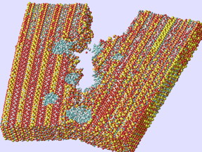 Rice University researchers used computer models of concrete's inner matrix to show how tiny holes filled with portlandite (blue) impart strength and toughness by preventing the spread of cracks.Image by Ning Zhang/Rice University