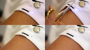 Nanoengineers printed a self-healing circuit on the sleeve of a T-shirt and connected it with an LED light and a coin battery. The researchers then cut the circuit and the fabric it was printed on. At that point, the LED turned off. But then within a few seconds it started turning back on as the two sides of the circuit came together again and healed themselves, restoring conductivity.
CREDIT
Jacobs School of Engineering/UC San Diego