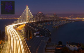 Eastern span of the San Francisco-Oakland Bay Bridge. The old and the new bridge, as seen at night from Yerba Buena Island to Oakland (mid-September 2013). The inset in the top left hand corner shows V Vanadium and 2H, Deuterium a hydrogen isotope (1 proton plus 1 neutron and 1 electron) as a Hydrogen substitute.

Photo credit Frank Schulenburg.