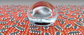 Rare earth oxides (red/orange) react with gaseous organic compounds from the ambient air to form carbonates and hydroxides (grey/white). Through this reaction, the surface develops water-repelling properties.
CREDIT
University of Basel, Department of Physics