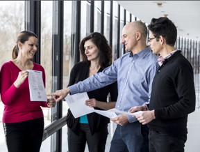 Inventors from IBM Research discuss Maja Vukovic's patent for a system that detects and counteracts cyber attacks, one of the more than 1,400 AI patents IBM inventors received in 2017 alone. 2017 marks the 25th consecutive year that IBM has been named the leader in granted U.S. patents, with a record 9,043 patents. (Credit: Jon Simon/Feature Photo Service for IBM)