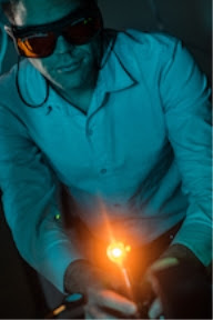 Rice University postdoctoral researcher Sean Collins adjusts a laser during experiments to take data from plasmonic nanoparticles. Rice scientists developed a snapshot hyperspectral imaging system to take instantaneous spectra of multiple plasmonic nanoparticles. (Credit: Jeff Fitlow/Rice University)