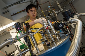 Researchers at Rice University, including graduate student Xinwei Li, have observed and measured a Bloch-Siegert shift in strongly coupled light and matter in a vacuum. The project could aid in the development of quantum computers. (Credit: Jeff Fitlow/Rice University)

