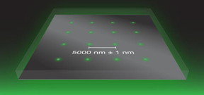 Illustration shows an array of apertures with a spacing of 5000 nanometers (nm)  1 nm. The apertures pass light through a metal film on a glass slide. Imaging the aperture array with an optical microscope results in apparent errors in the spacing between apertures. Knowledge of the true spacing allows correction of these imaging errors. This calibration process enables accurate measurements of position across a large image.
Credit: NIST
