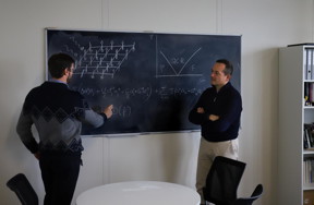 Riccardo Rota and Vincenzo Savona, the two EPFL physicists leading the study, working on the design of their quantum simulator.

CREDIT
R. Ravasio/EPFL