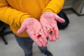 Muhamed Duhandić holds two pieces of the organic semiconductorthe blue polymer has been doped with an iodine dopant.

CREDIT
Harriet Richardson/University of Utah